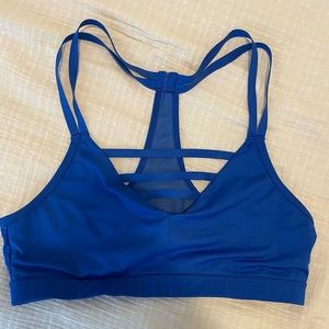 Royal blue Marika sports bra with mesh detail and fun straps! Size medium